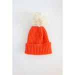 Orange knit Eloise Pom Pom Beanie for kids, perfect for stylish moms’ winter outfits