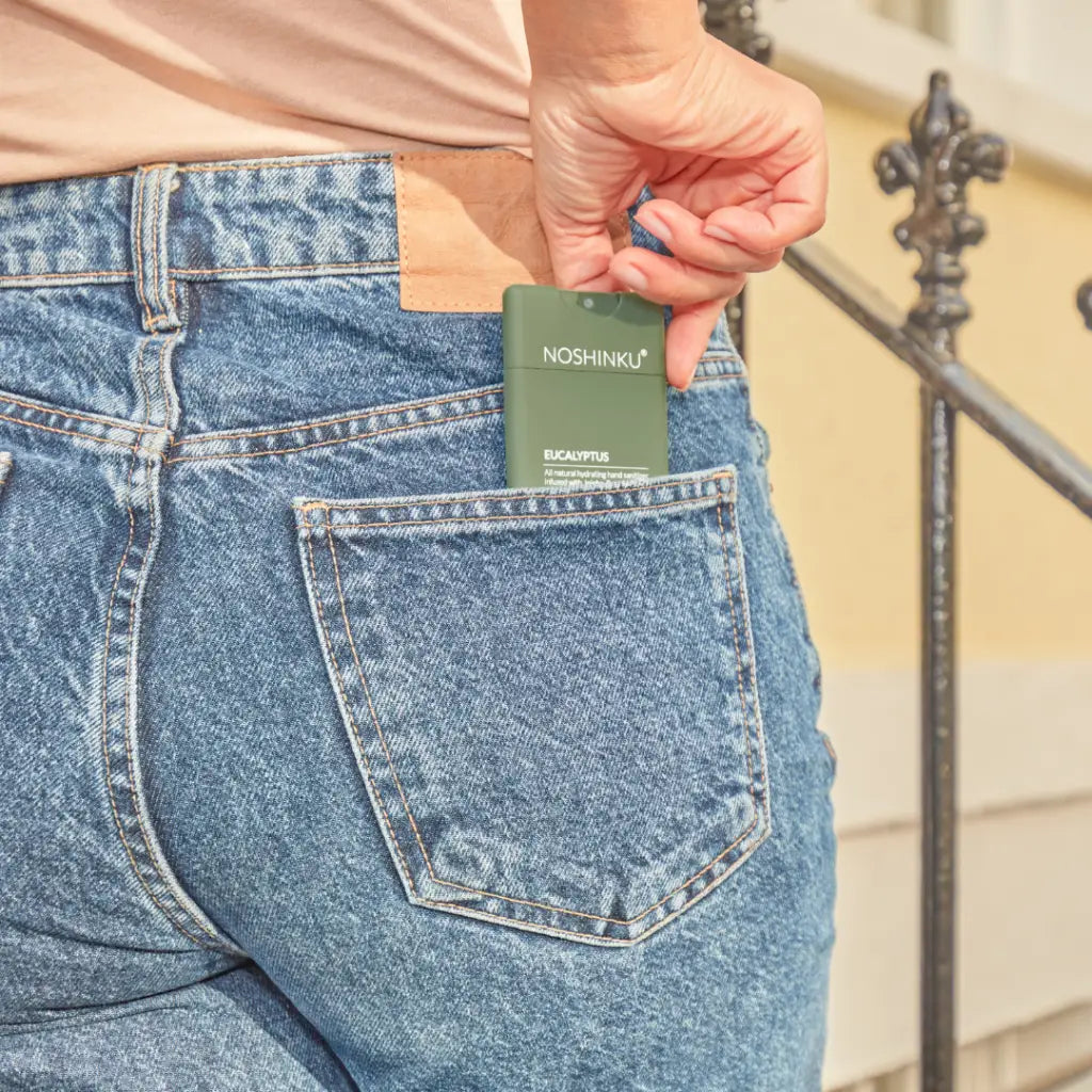 Green Noshinku pocket hand sanitizer wallet with textured design