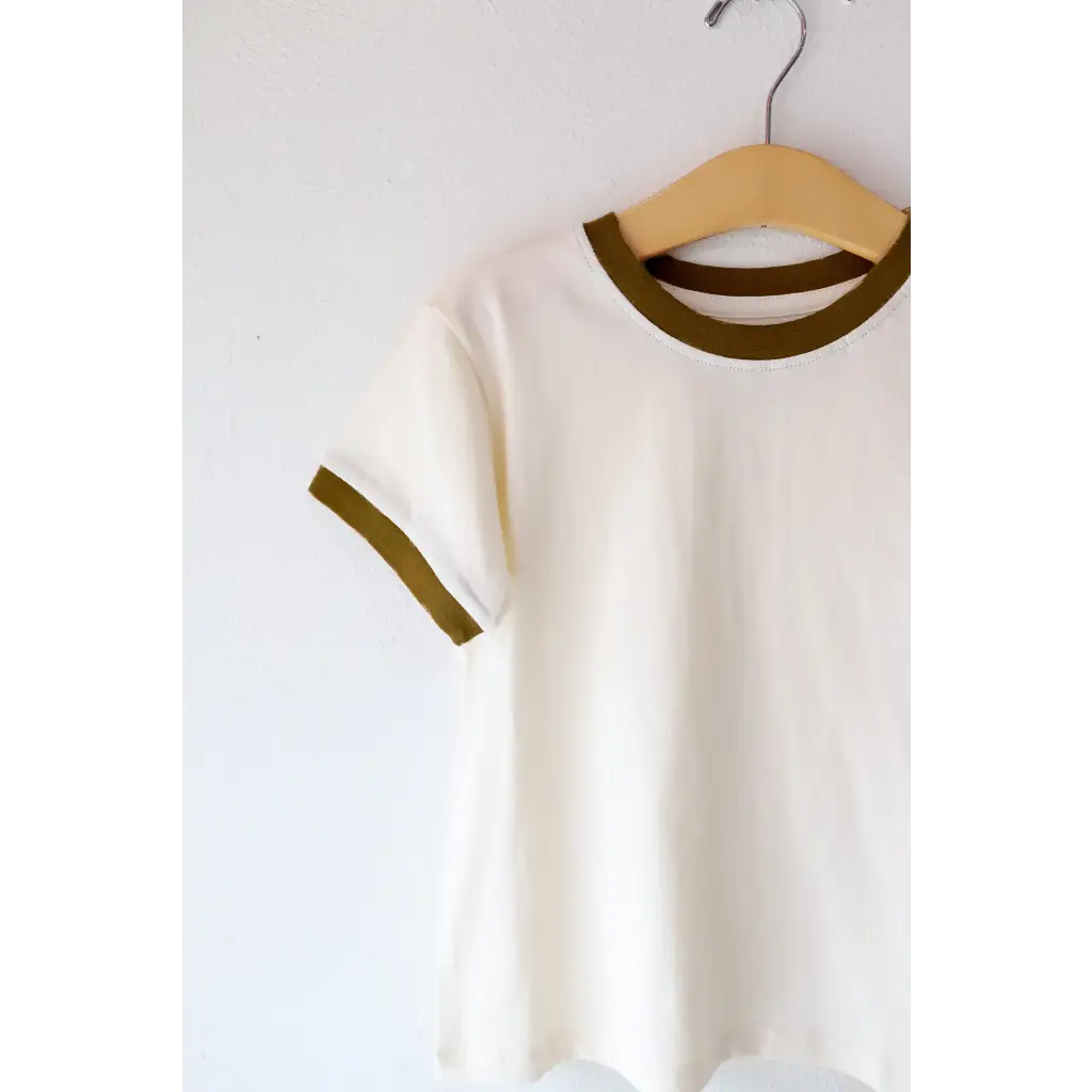 White Everyday Ringer Tee for Kids with Brown Trim on Wooden Hanger