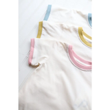 White fabric with pink, gold, and blue trim on a Retro Pastel Trim Everyday Ringer Tee for Kids