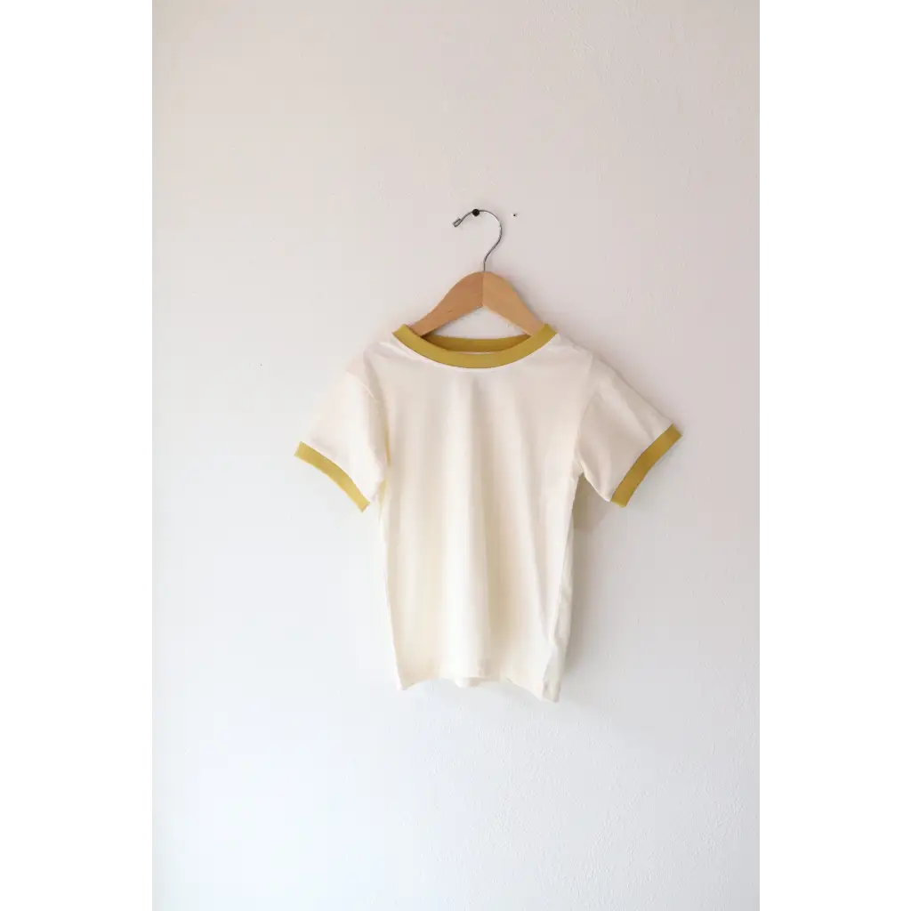 White and yellow trimmed Retro Pastel Trim Everyday Ringer Tee for Kids on a hanger