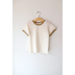 White Everyday Ringer Tee with Olive Green Trim hanging on a hanger for casual style