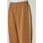 Olive green everyday tracksuit pants with tan wide-leg, elastic waist, and beige side stripe