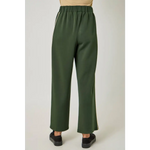 Olive green satin tracksuit pants with elastic waist and black slip-on shoes for stylish womens clothes