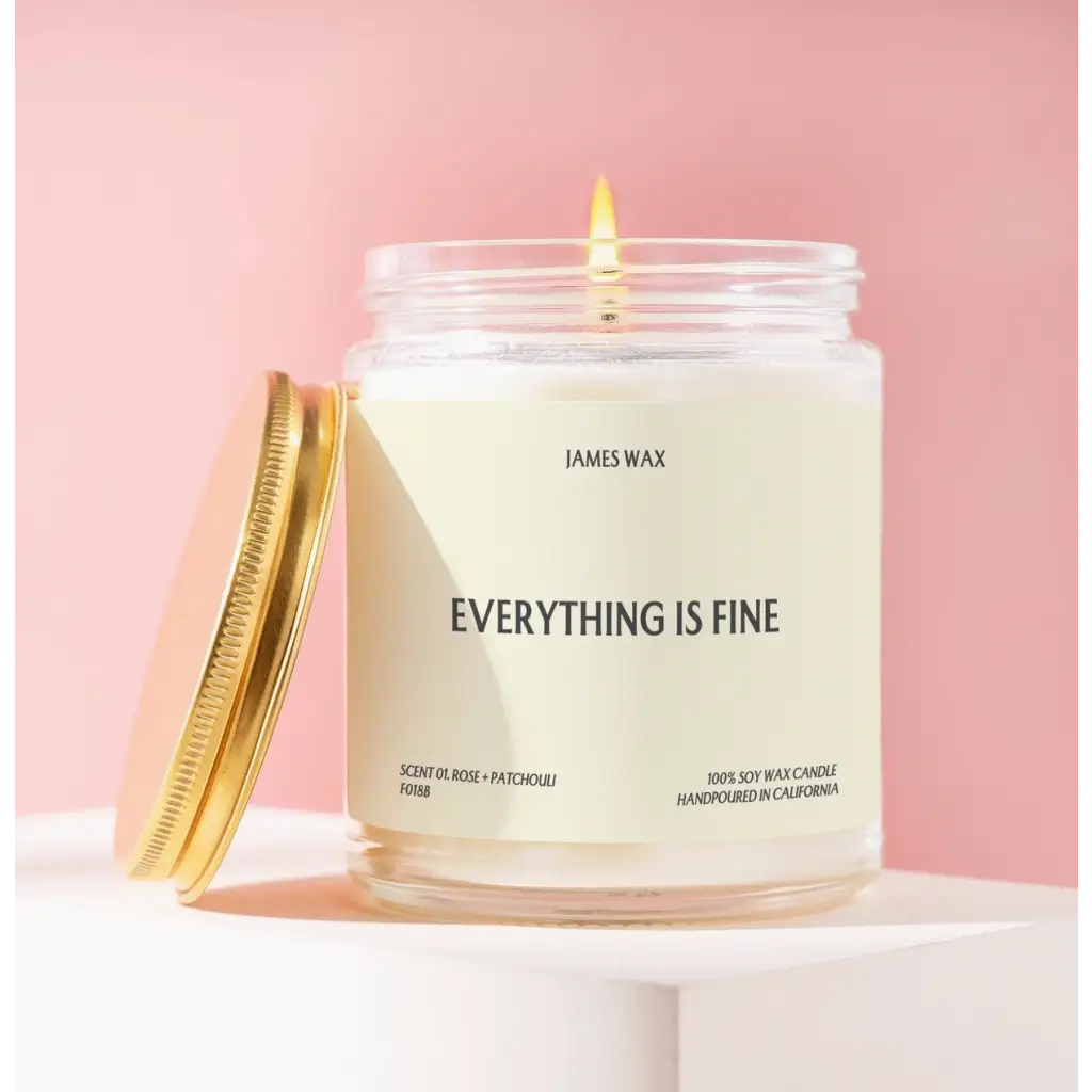 White candle in jar with Everything is Fine label and pineapple sparkling citrus scent