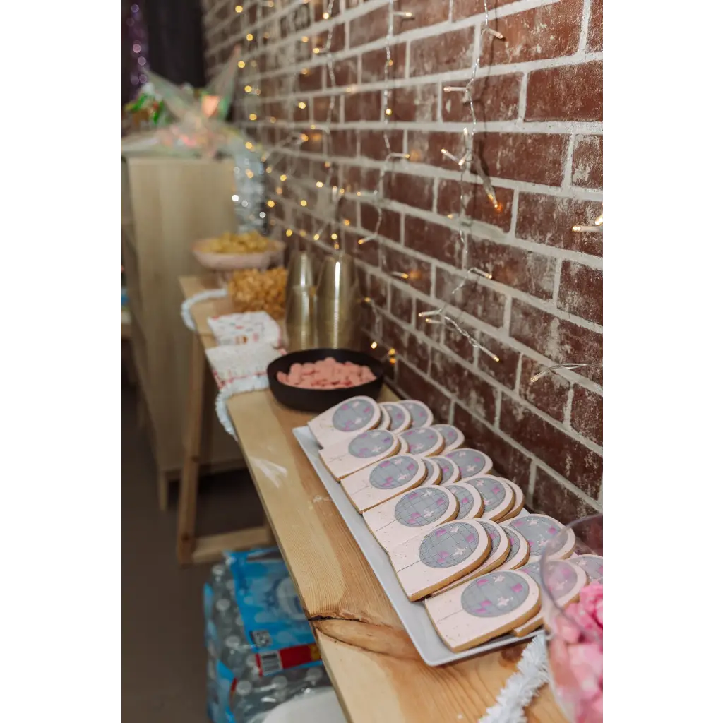 Row of decorated sugar cookies with extra decoration setup by our staff members