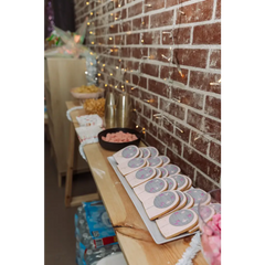 Row of decorated sugar cookies with extra decoration setup by our staff members