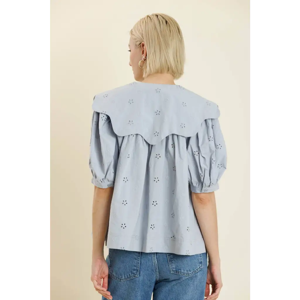 Light blue eyelet blouse with scalloped collar and puff sleeves, perfect for stylish womens clothes