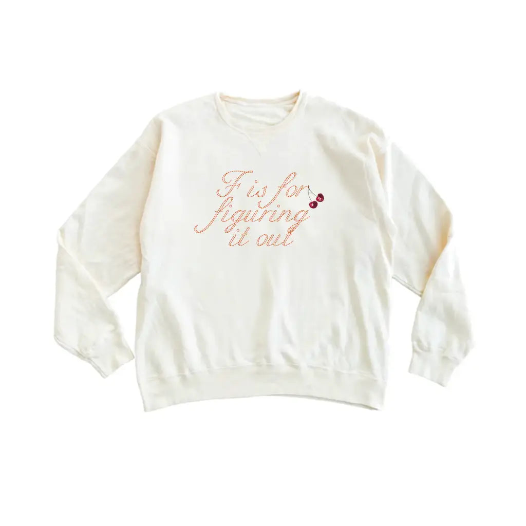 Cream-colored F is for Figuring It Out sweatshirt with polished prints of cursive text and red cherries, stylish womens clothes