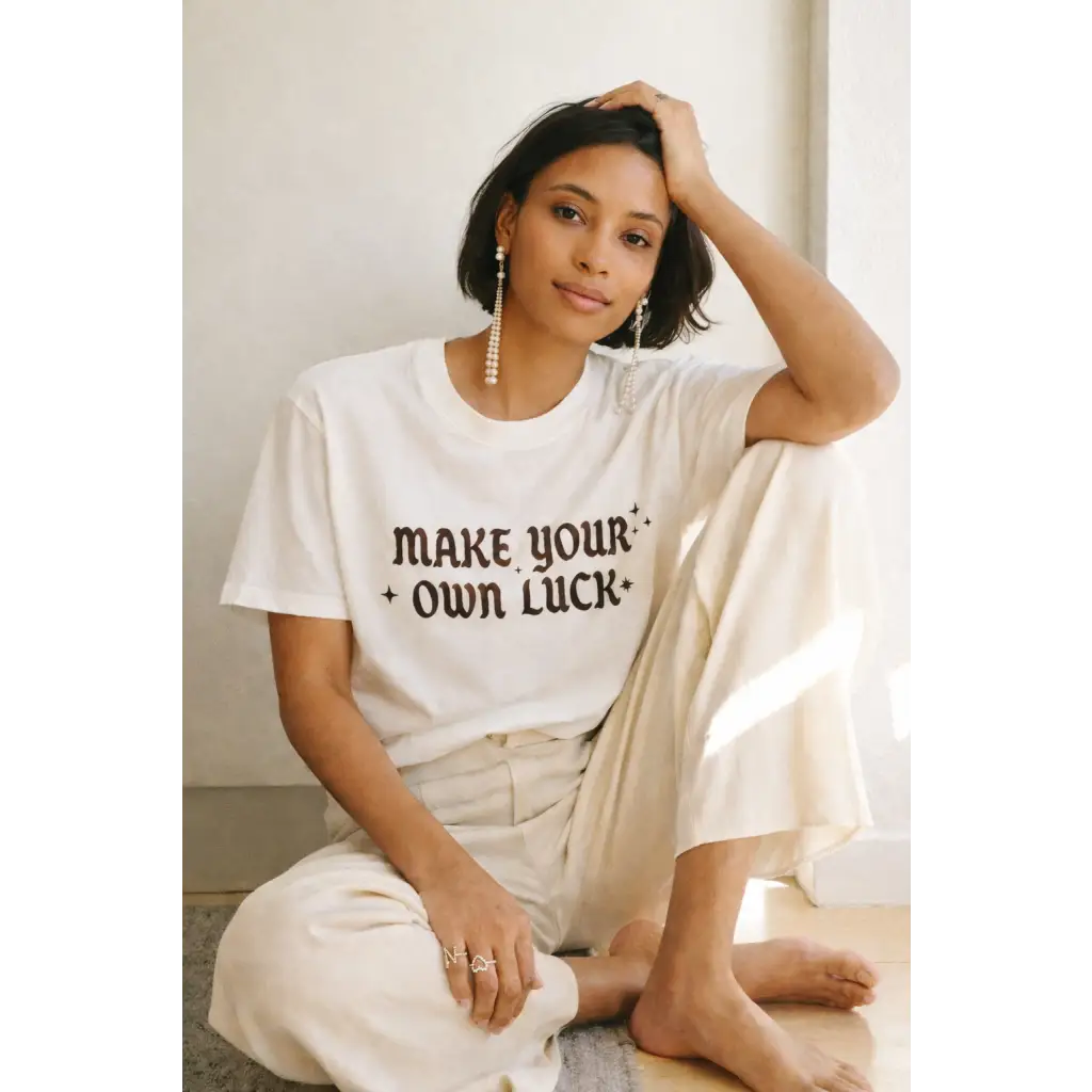 White oversized unisex tee with Make Your Own Luck graphic in cotton comfort