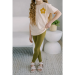 Long wavy blonde hair in a pink tee and Good Vibes flexible lightweight olive green leggings