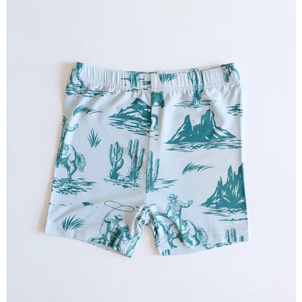 Kids rodeo short set with white shorts featuring fun teal desert landscape print