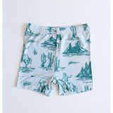 Kids rodeo short set with white shorts featuring fun teal desert landscape print