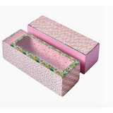 Cute pink floral gift boxes showcasing the Floral Tumbling Tower Game inside