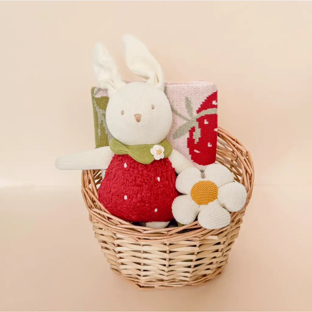 White plush bunny in a red dress in a basket, perfect for an Organic Cotton Flower Cuddly Lovey