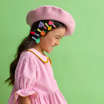 Pink felt beret with colorful fruit hair clips