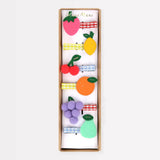 Colorful felt fruit hair clips in cardboard box