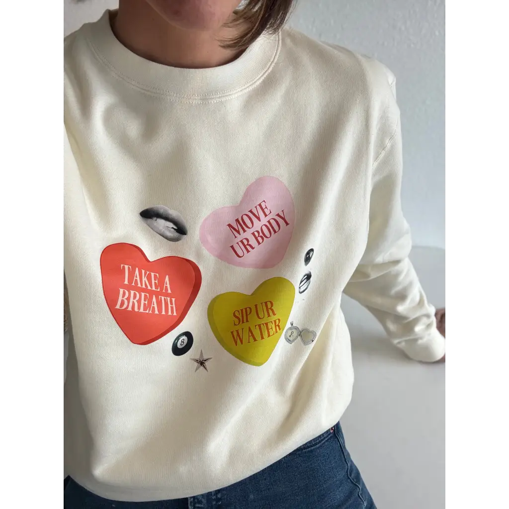 Gentle reminders cream crewneck sweatshirt with colorful heart candies and polished prints
