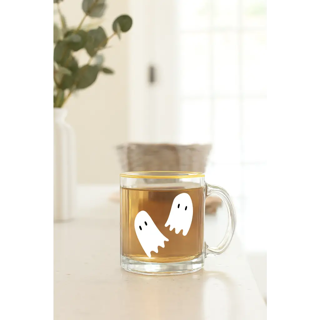 Clear glass mug with ghost decals, perfect for stylish womens clothes and polished prints