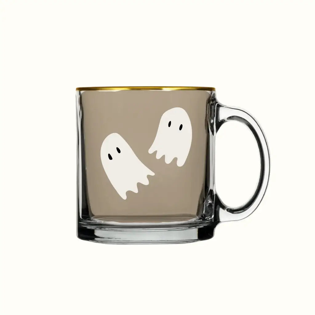 Clear glass mug with gold rim and ghost prints, perfect for stylish womens clothes or moms