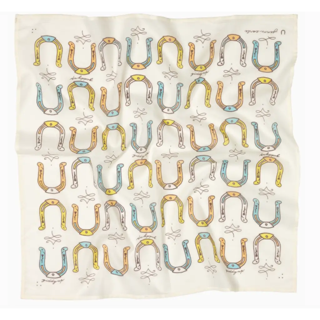 Wrinkled fabric with horseshoe pattern from Giddy Up Cotton Voile Bandana in cream, perfect for stylish womens clothes and moms