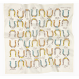 Wrinkled fabric with horseshoe pattern from Giddy Up Cotton Voile Bandana in cream, perfect for stylish womens clothes and moms