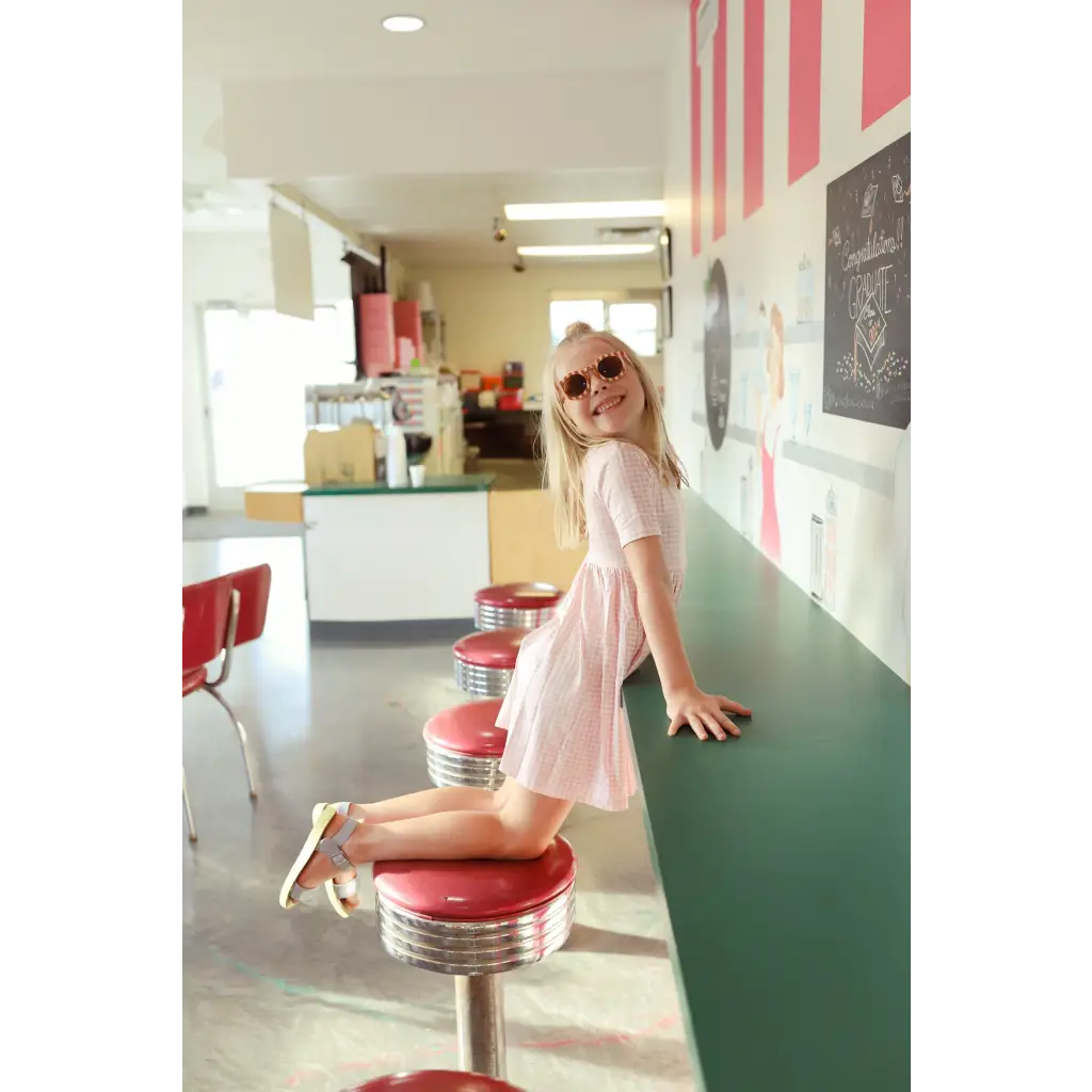 Retro diner stool with red vinyl and chrome, perfect for day twirl dress photos