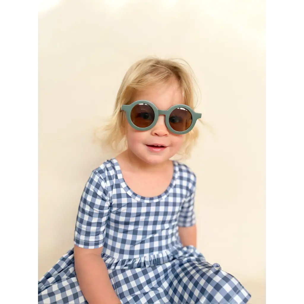 Gingham bamboo twirl dress in blue white checks with gray frame sunglasses