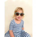 Gingham bamboo twirl dress in blue white checks with gray frame sunglasses