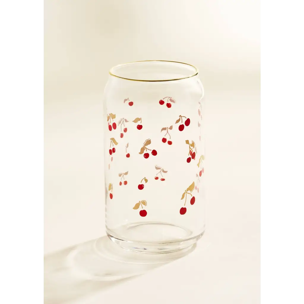 Clear glass can-shaped tumbler with gold rim and red cherry pattern for stylish womens clothes