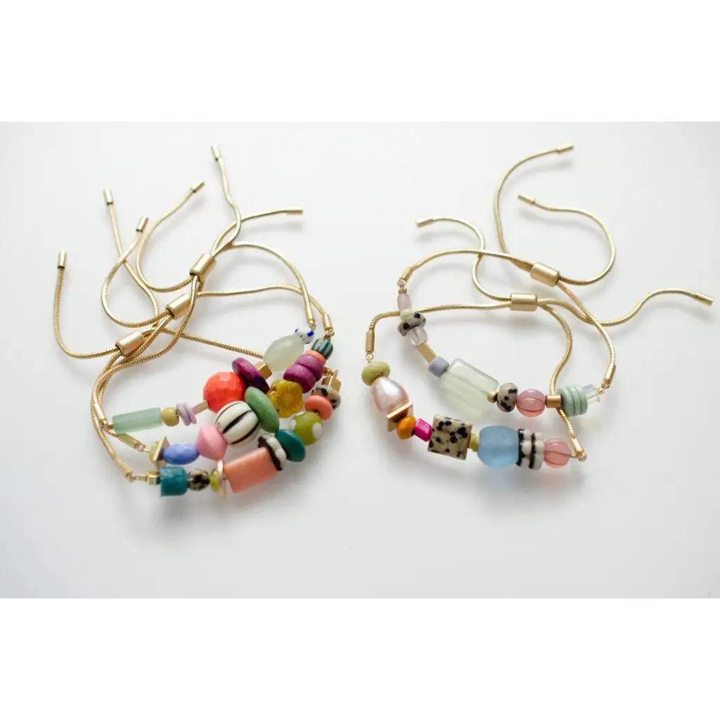 Gold pull tie beaded bracelets in colorful pastel beads