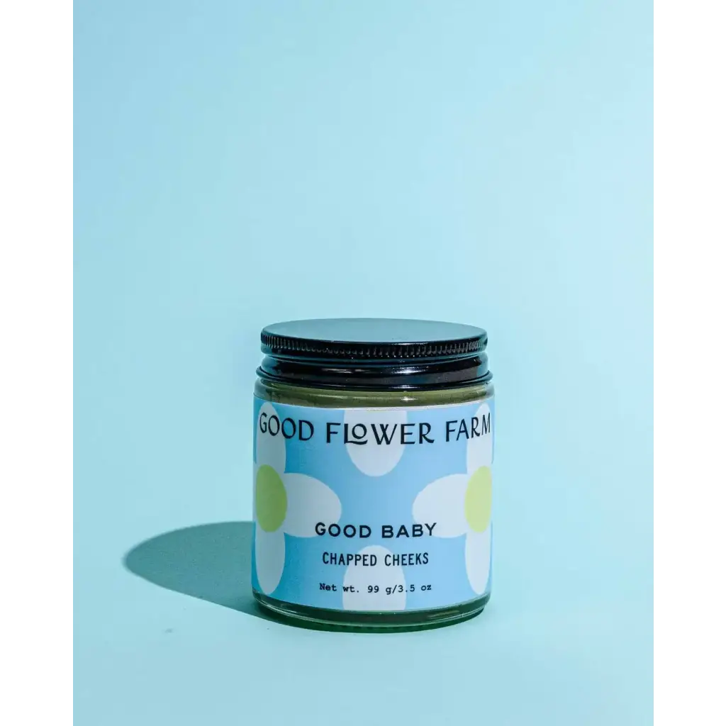 Good Baby Chapped Cheeks balm jar with daisies label for moms clothes