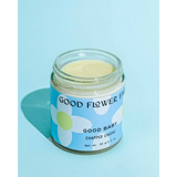 Good Baby Chapped Cheeks balm jar with daisy label, polished prints for moms