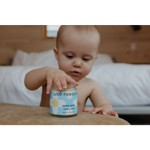 Good Baby Chapped Cheeks balm jar with good flower label for moms clothes