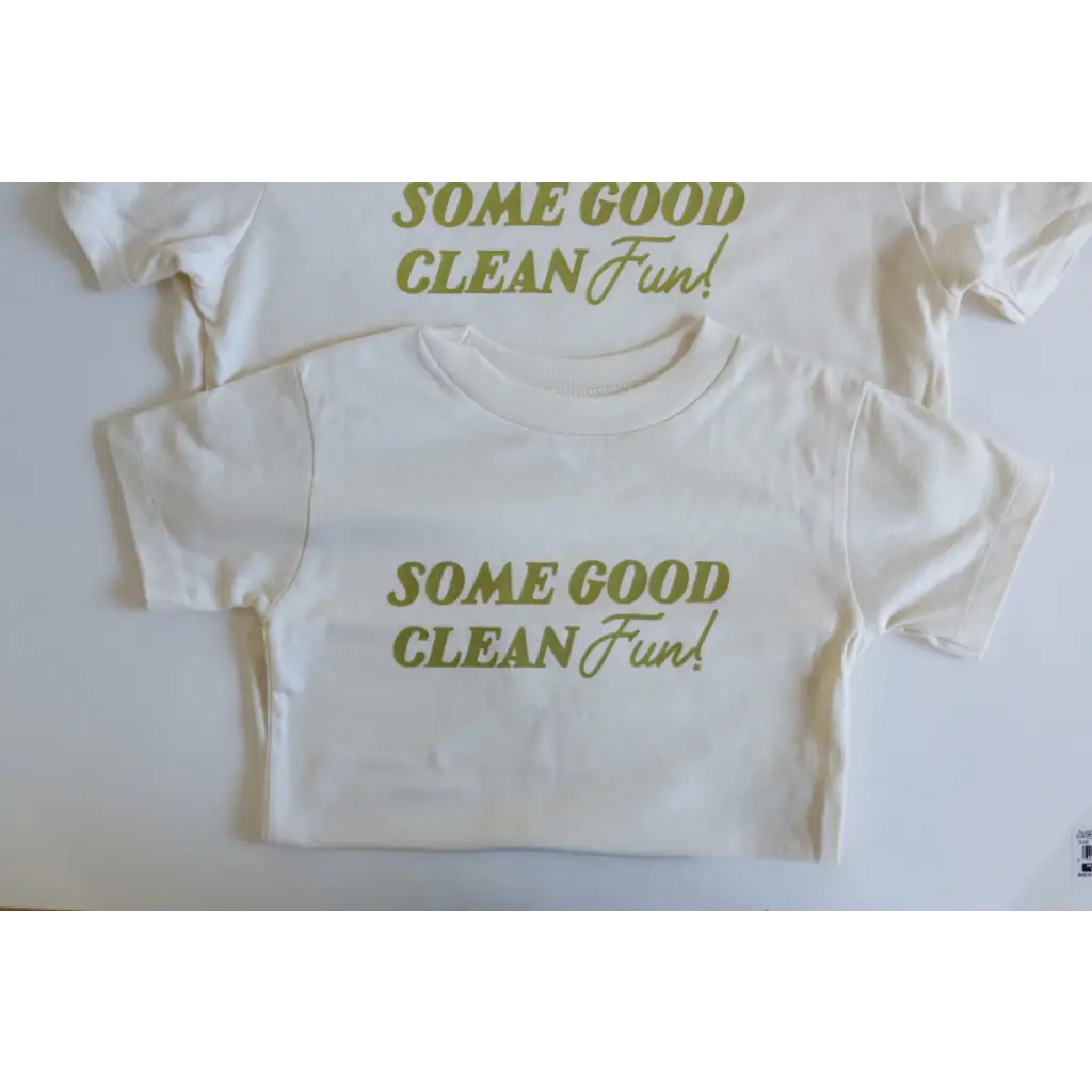 White kids tee with green text saying Some Good Clean Fun for playful style