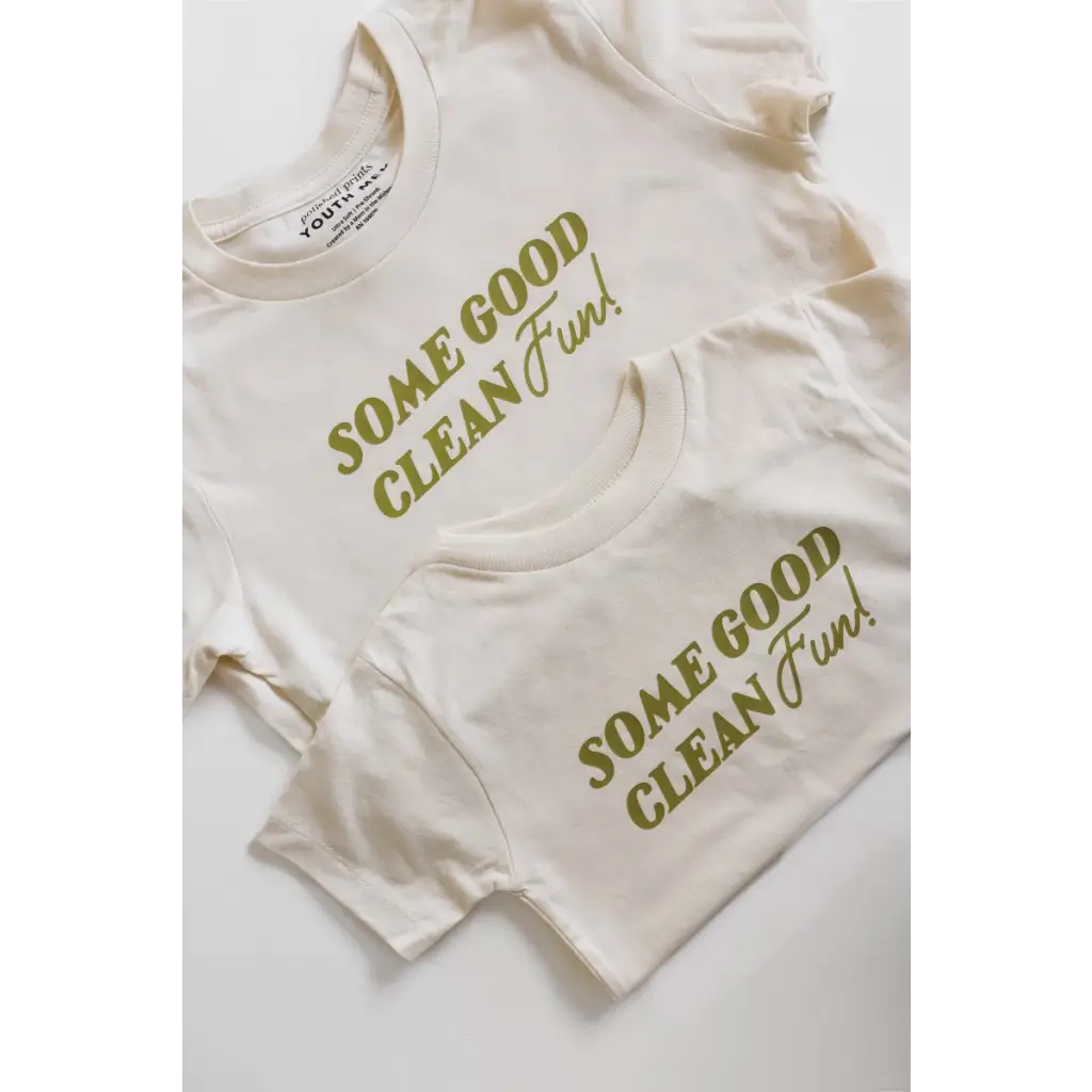 White kids tee with green Some Good Clean Fun text for playful adventures