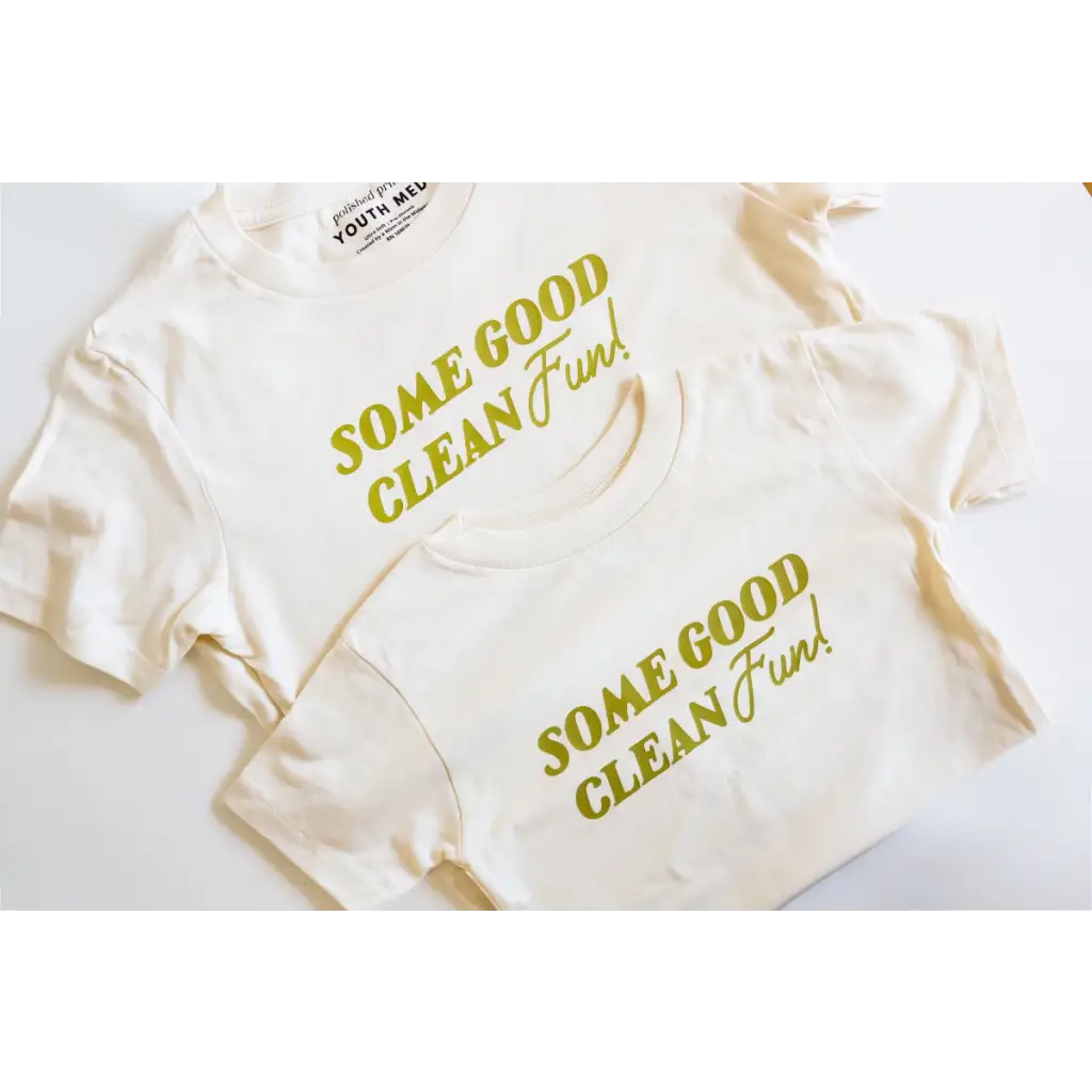 White kids tee with green text saying Some Good Clean Fun, perfect for playful adventures