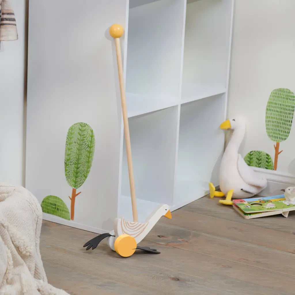 Wooden push toy shaped like a goose with yellow wheels, perfect as a goose push toy