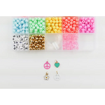 Colorful pastel plastic beads and charms in the Groovy Goals DIY Bracelet Craft Kit