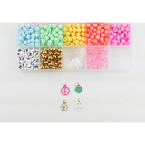 Colorful pastel plastic beads and charms in the Groovy Goals DIY Bracelet Craft Kit