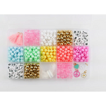 Colorful beads in a plastic organizer for the Groovy Goals DIY Bracelet Craft Kit