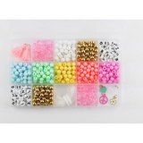 Colorful beads in a plastic organizer for the Groovy Goals DIY Bracelet Craft Kit