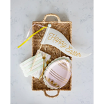 Easter-themed party supplies in a basket with Happy Easter Felt Pennant Decoration