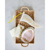 Easter-themed party supplies in a basket with Happy Easter Felt Pennant Decoration