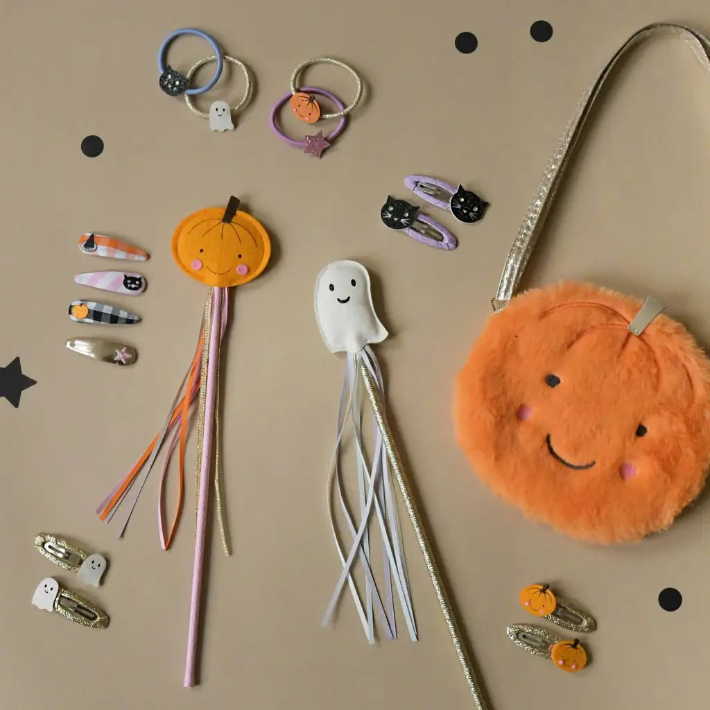 Halloween-themed hair accessories and fuzzy pumpkin purse for stylish womens clothes