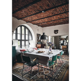 Happy Homes dining table with white patterned cloth and green chairs