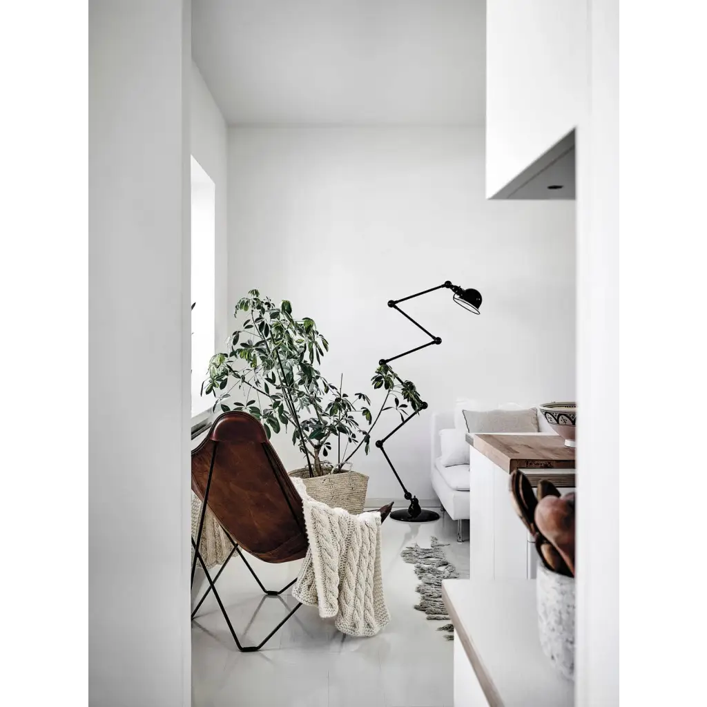 Happy Homes brown leather butterfly chair with black metal frame