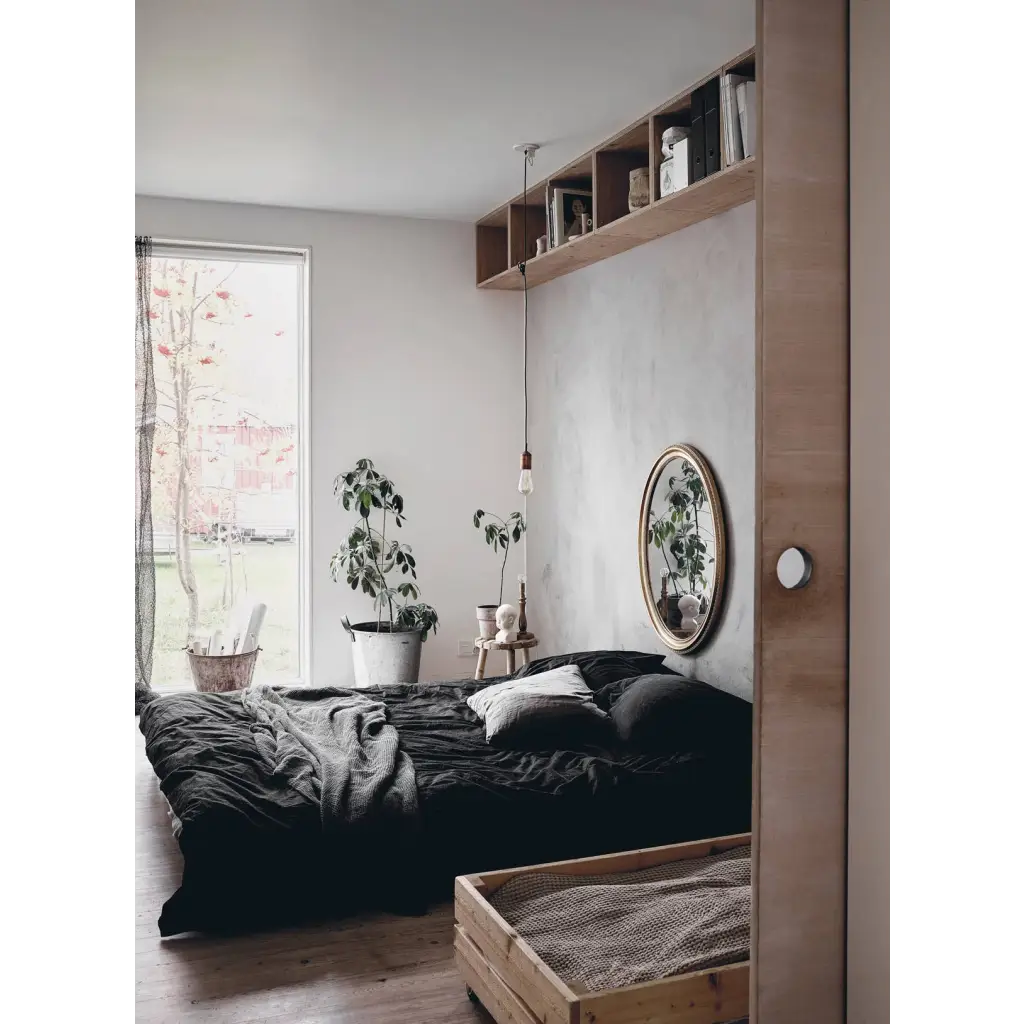 Happy Homes gold-framed mirror with polished prints reflecting room