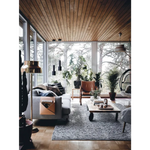 Gray Happy Homes sofa with pillows and tan leather holder