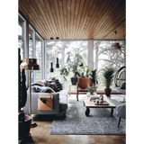 Gray Happy Homes sofa with pillows and tan leather holder